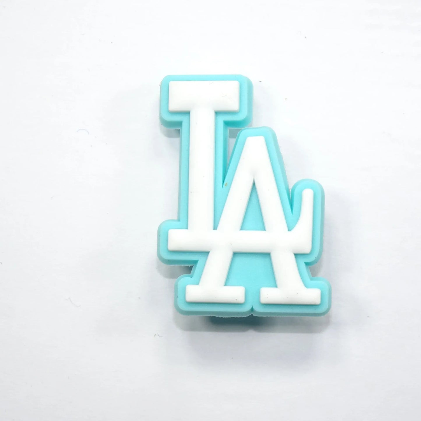La Stylised Logo White On Aqua Shoe Charm