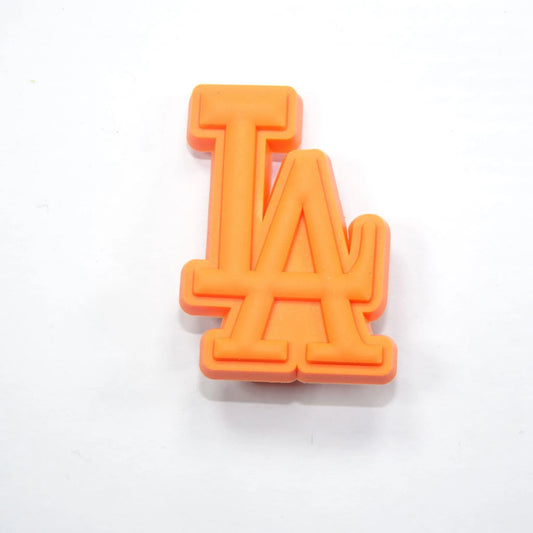 La Stylised Logo Orange Shoe Charm