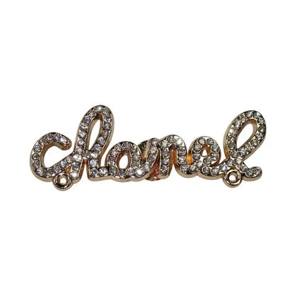 Shoe charm - chanel diamond encrusted gold metal