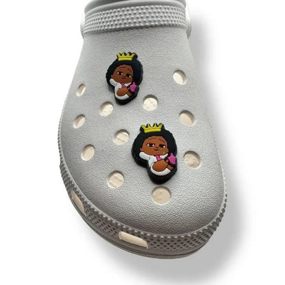 Little Girl wearing a Crown shoe charm BC